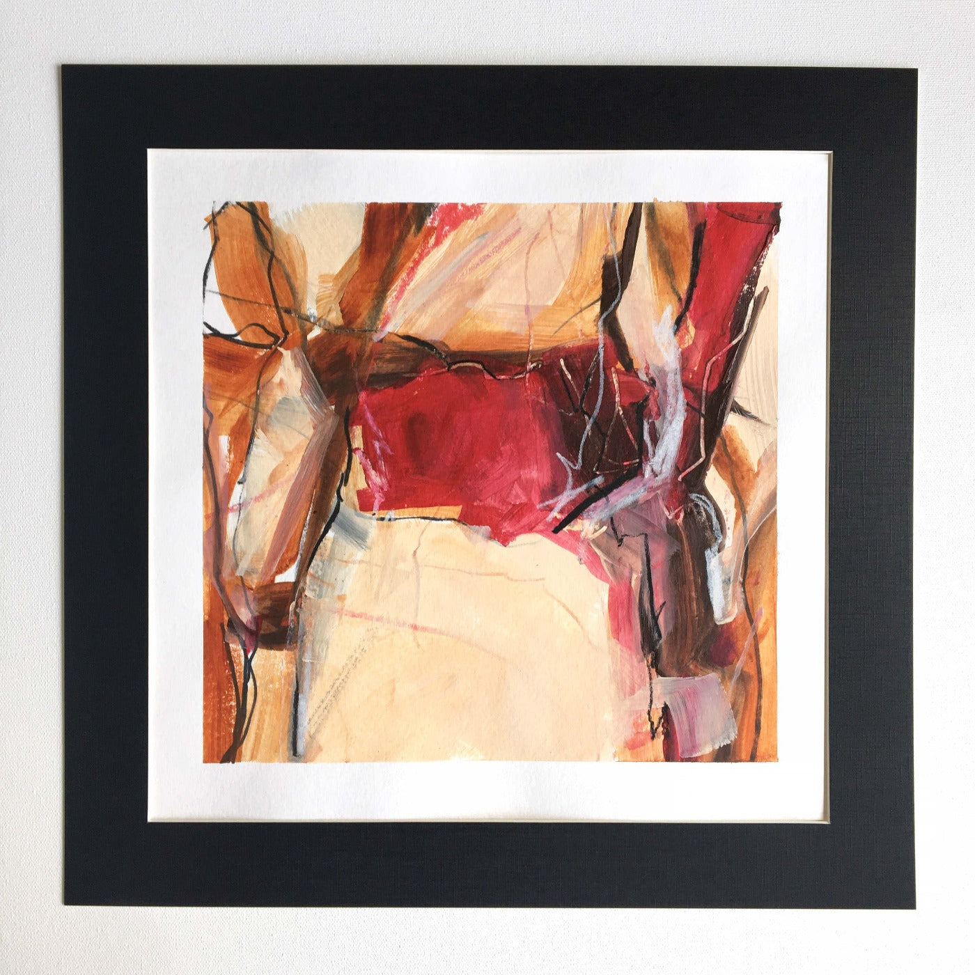 One-of-a-kind mixed media artwork in white, Naples yellow light, brown, red, raw sienna, and black colors. Intuitive and dynamic composition in the artist's art practice. Framed in black, matt paper frame.