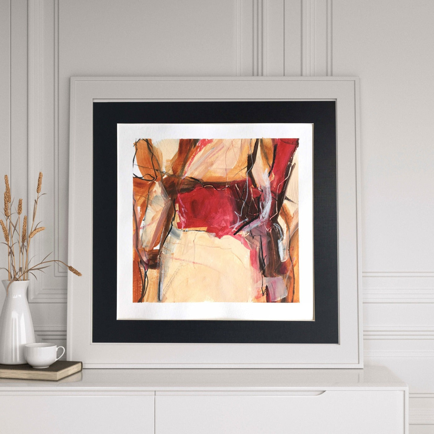 One-of-a-kind mixed media artwork in white, Naples yellow light, brown, red, raw sienna, and black colors. Intuitive and dynamic composition in the artist's art practice. Framed in black, matt paper frame. Mockup