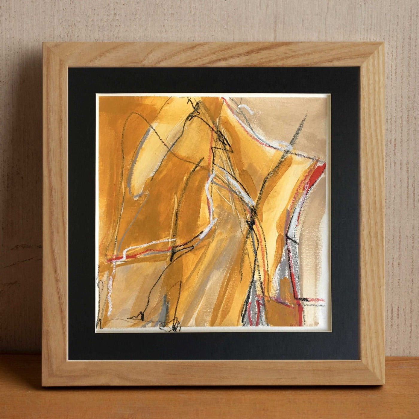 Acrylic | Mixed Media on paper. One-of-a-kind mixed media artwork in ochre, warm gray, white, burnt sienna, red, and black colors. Intuitive composition in the artist's art practice. Framed in black, matt paper frame. Mockup 