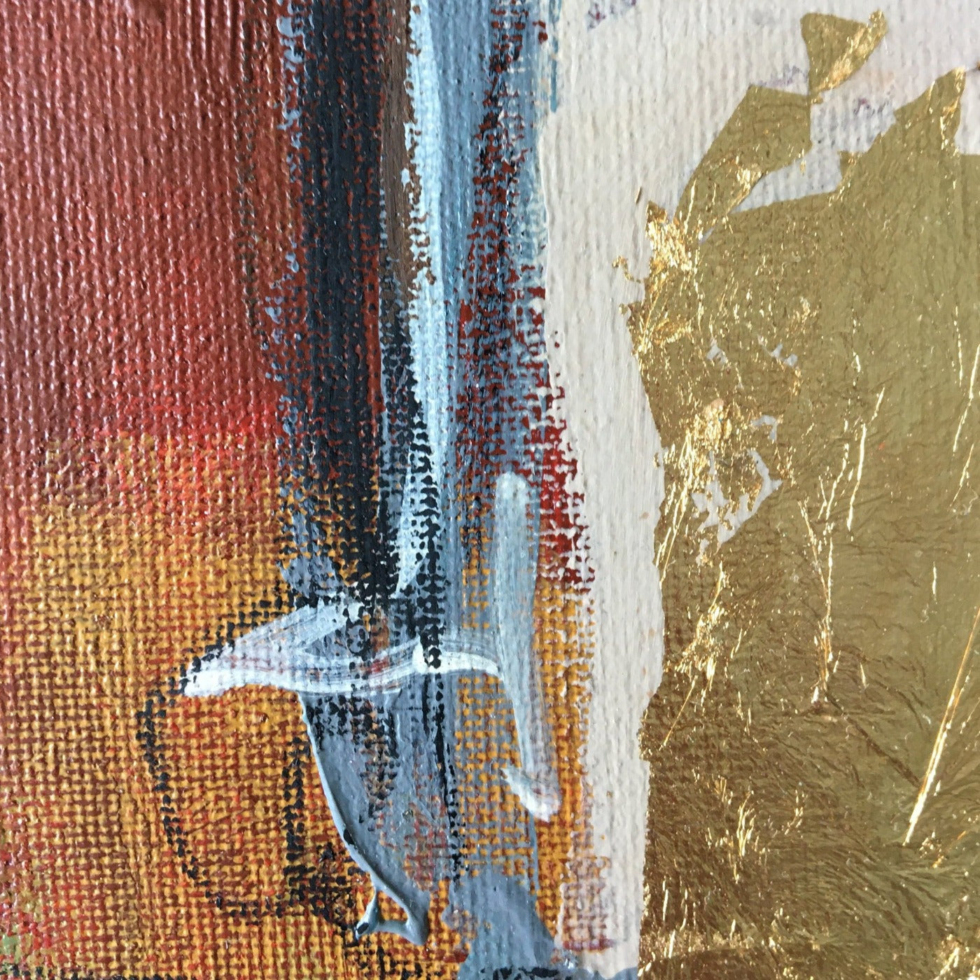 Abstract painting in burnt sienna, light blue, white colors, and gold foil. The artwork is made with acrylic colors and mixed media. Detail