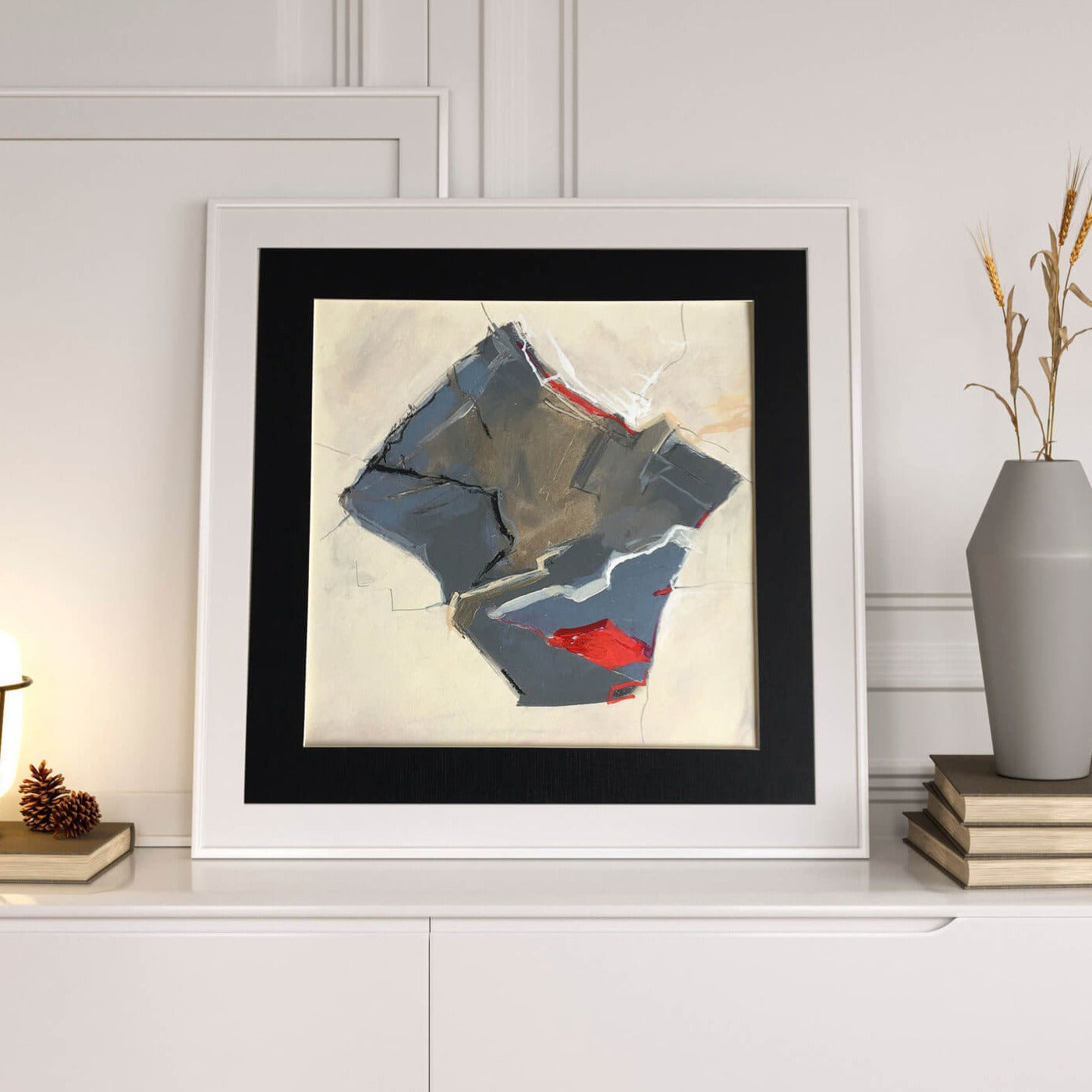One-of-a-kind mixed media artwork HOLIDAY LANDSCAPE on paper in white, red, and black colors. Intuitive and dynamic composition in the artist's art practice. Framed in black, matt paper frame. Mockup