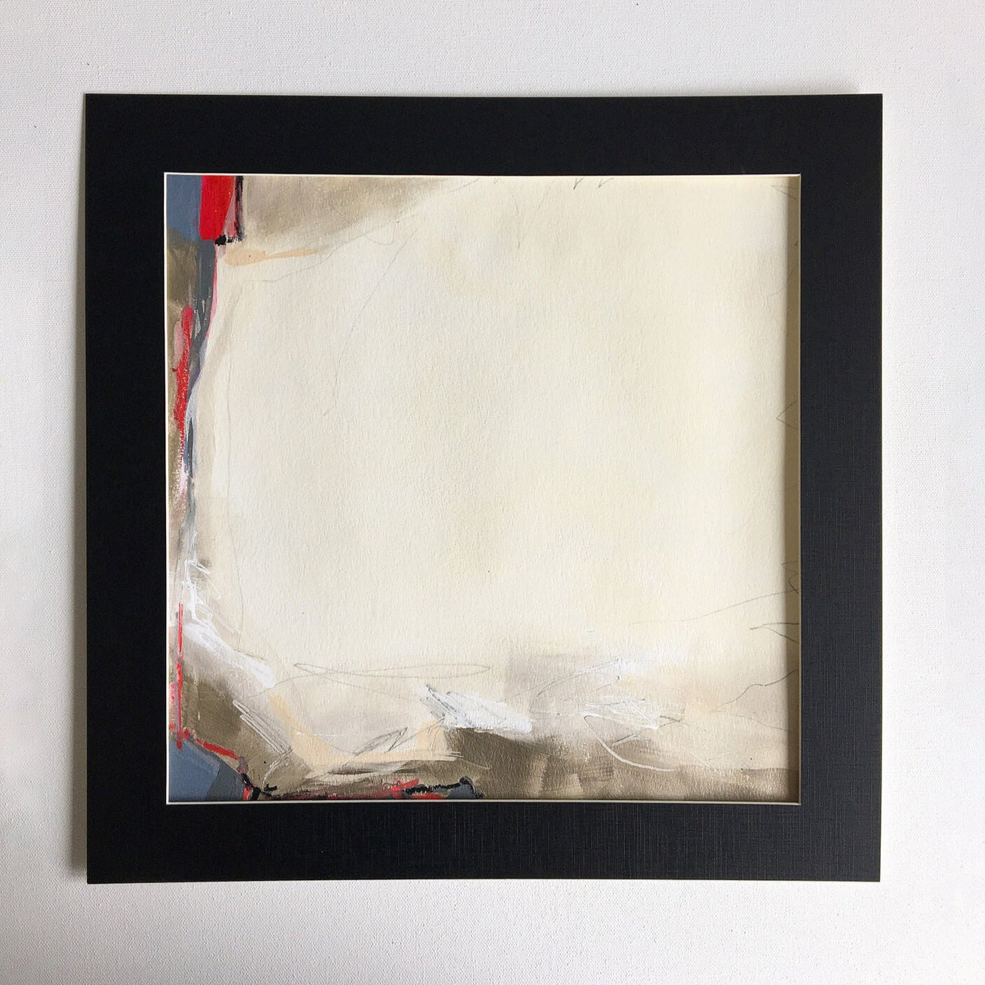 One-of-a-kind mixed media artwork THE SILENCE OF THE HOLIDAY LANDSCAPE on paper in white, red, and black colors. Intuitive and dynamic composition in the artist's art practice. Framed in black, matt paper frame.